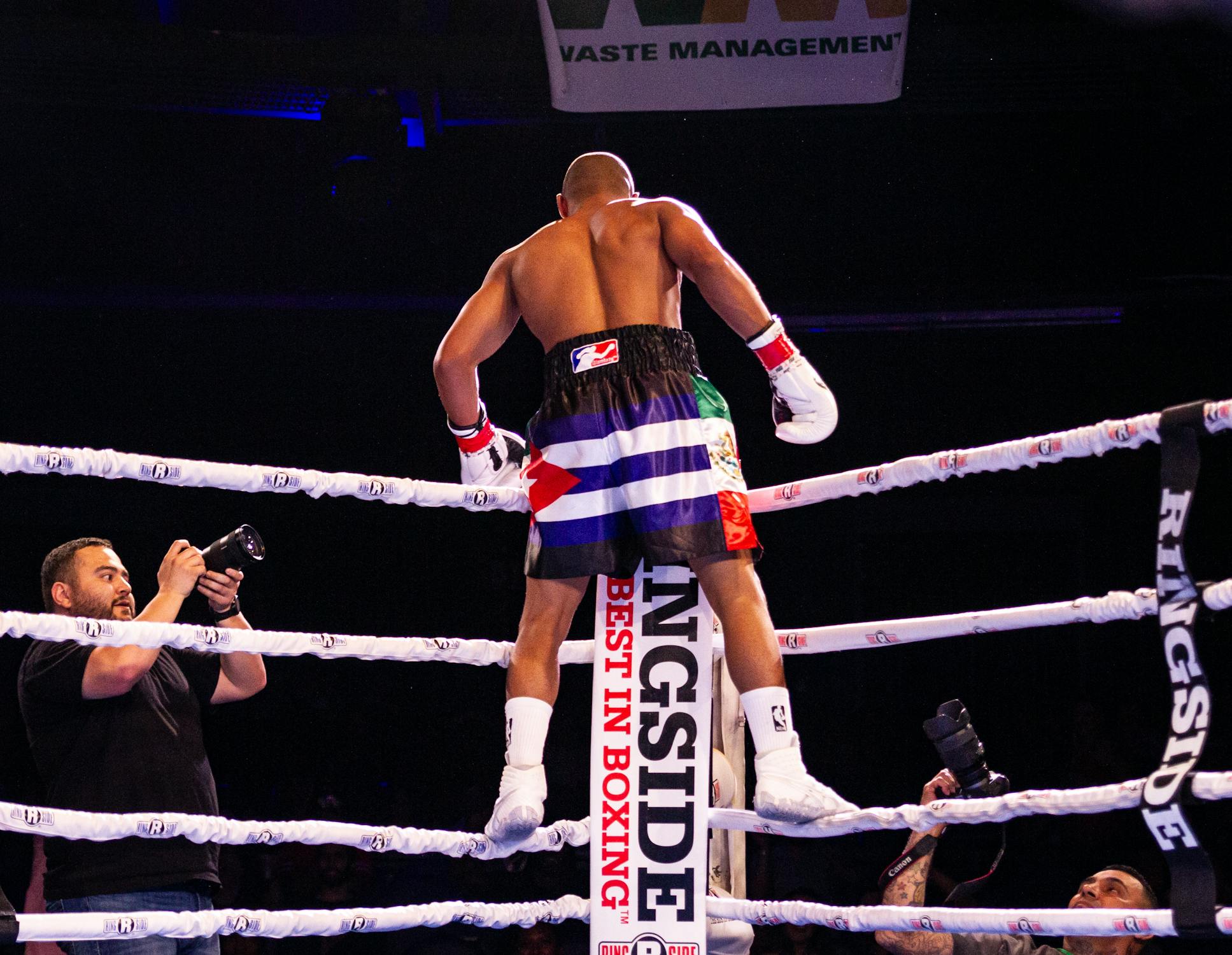 Boxer Standing On The Ropes Of A Boxing Ring · Free Stock Photo