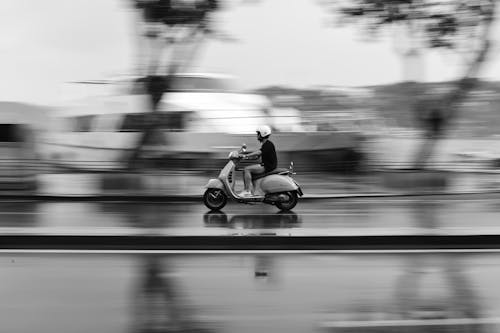 Free Grayscale Photo of Man Riding Motorcycle Stock Photo