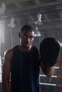 Man in Blue Tank Top Holding Black Round Speaker