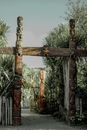 Carved Wooden Totems On Gateway