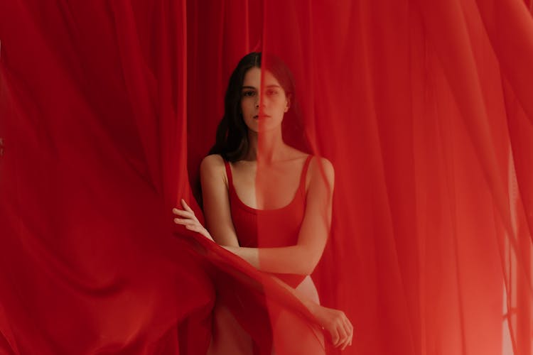 Woman In Red Bikini Hiding On Curtain 