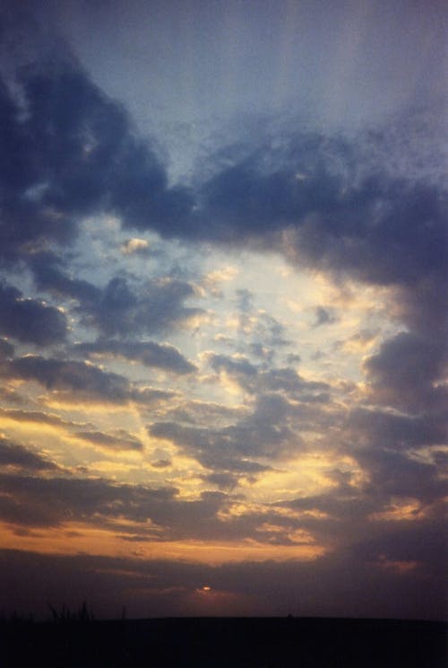 Blue and White Cloudy Sky At Dawn