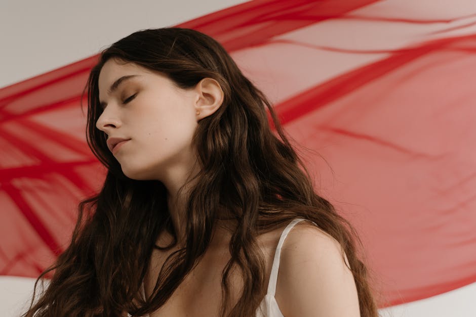 Woman with long, flowing raw hair extensions - raw unprocessed hair