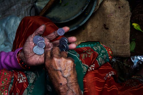 Person Holding Coins