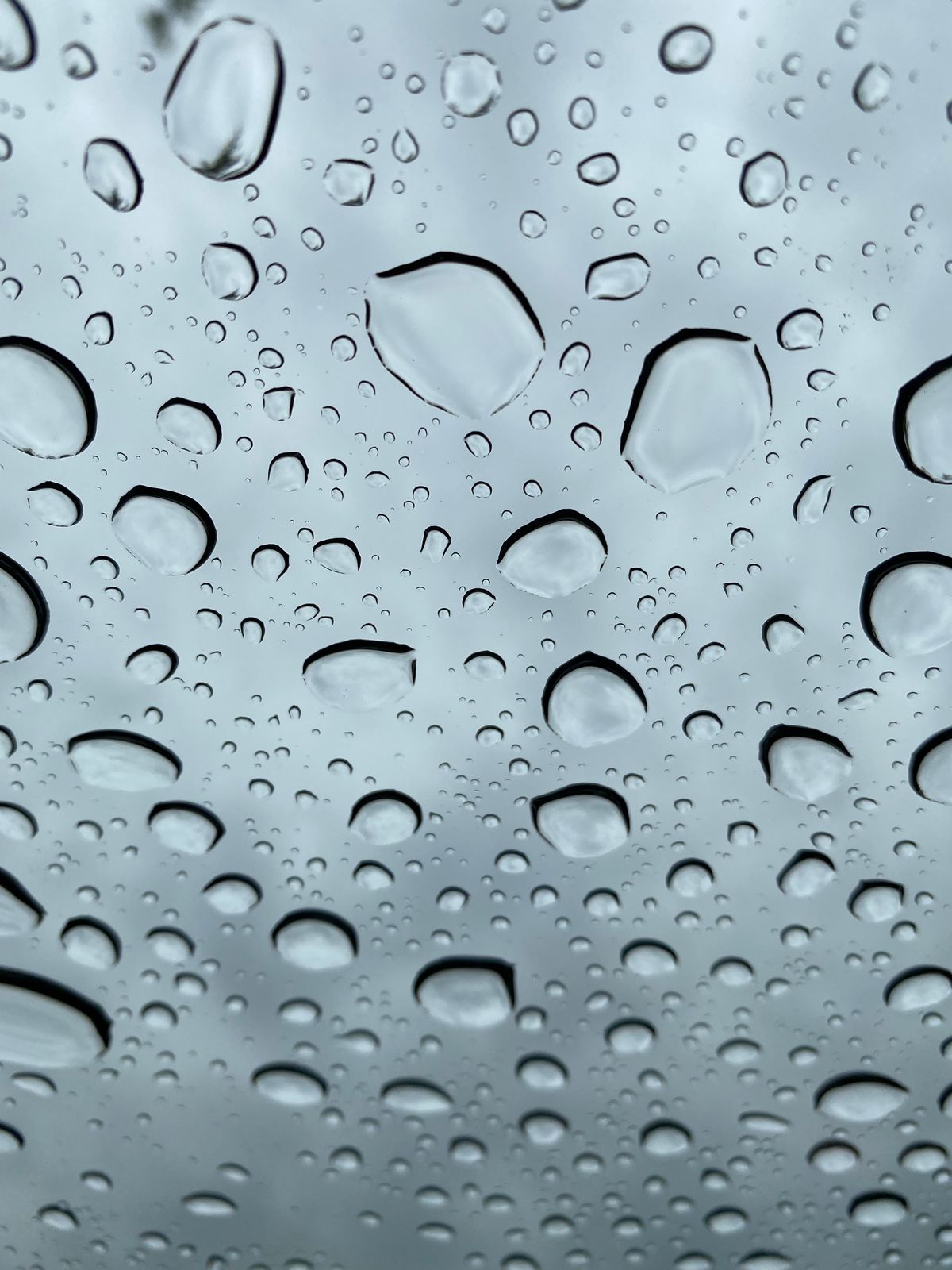 Water droplets beading on freshly cleaned glass