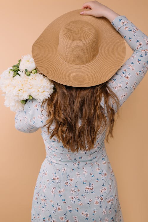 Free Woman with Long Hair Wearing Wide Brimmed Hat Stock Photo