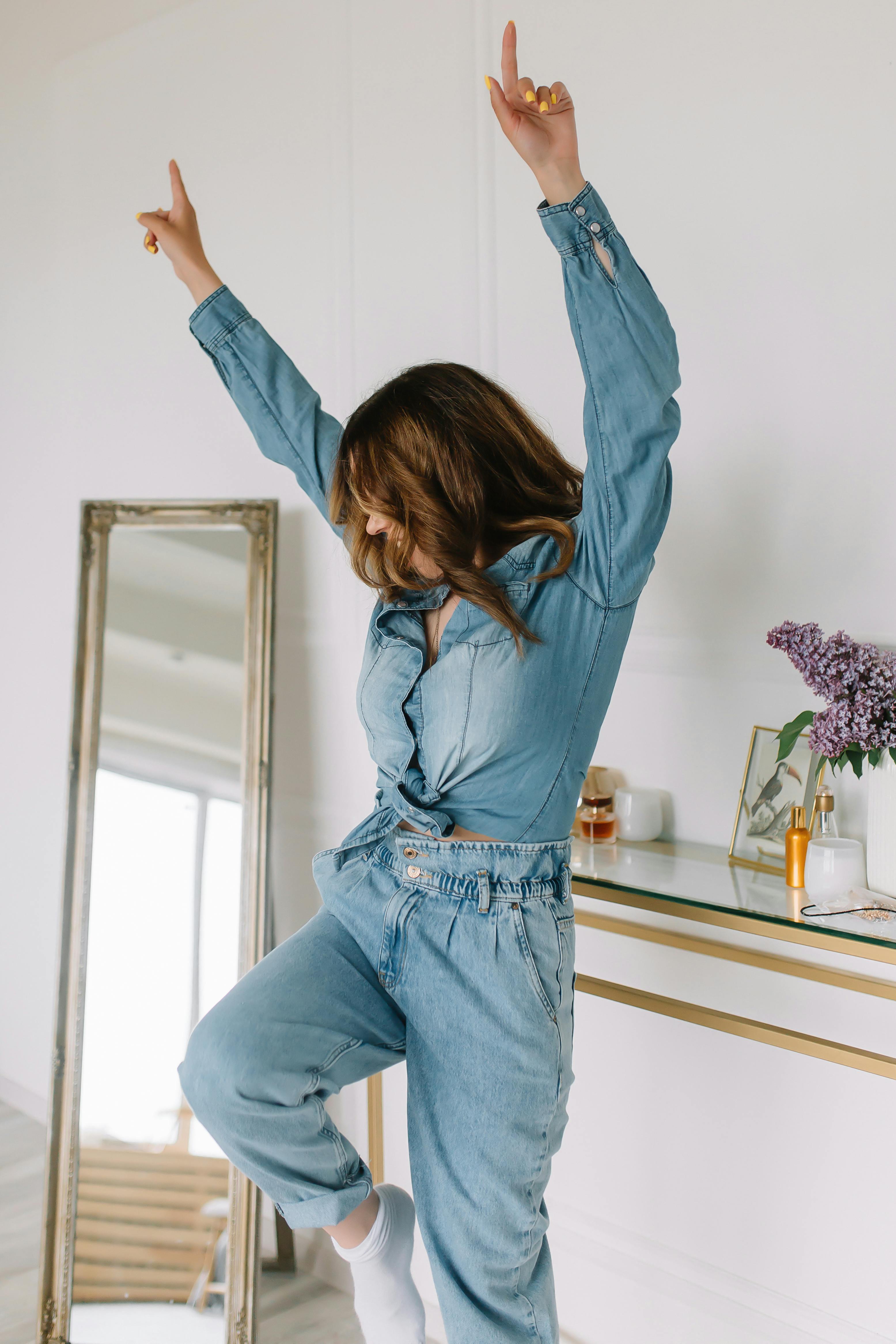 woman in denim clothes dancing