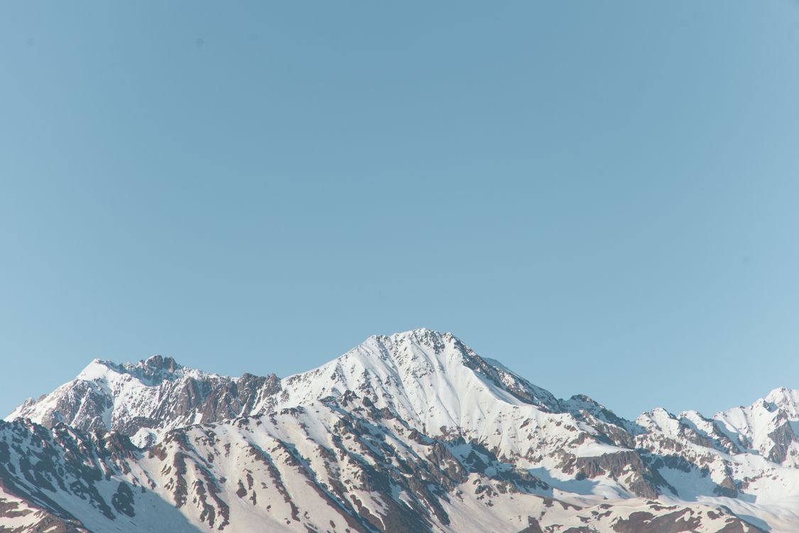 Snow Covered Mountain Under Blue Sky · Free Stock Photo