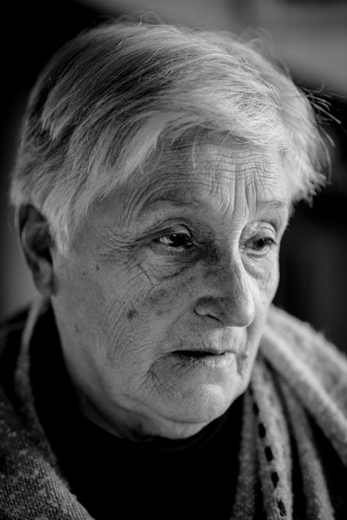 Grayscale Photo of an Elderly Woman's Face