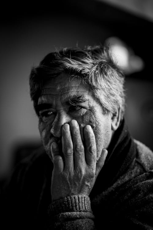 Free Elderly Man Resting His Head on His Hand Stock Photo