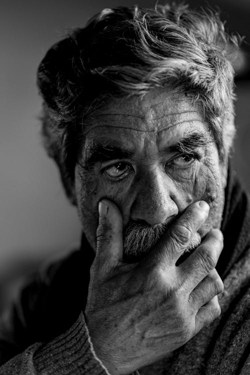 Free Elderly Man Smoking Cigarette In Grayscale Photography Stock Photo