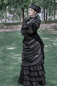 Portrait of a woman in Gothic Victorian fashion posing outdoors in Leipzig.. portrait, woman, gothic
