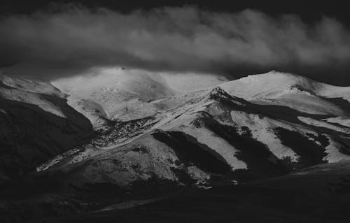 Grayscale Photography of Snow Covered Mountains