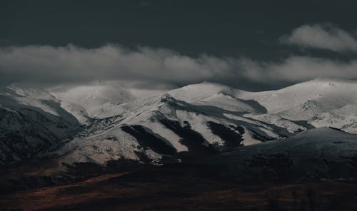 Photo of Mountains Covered in Snow