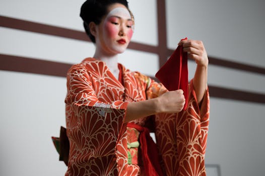 Beautiful geisha in traditional kimono performing with grace.