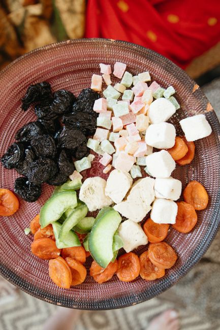 A vibrant plate featuring a mix of dried fruits and colorful candies, perfect as a sweet snack. - How to Buy High-Quality Dry Fruits: A Step-by-Step Process