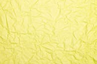 A Crumpled Yellow Paper Surface