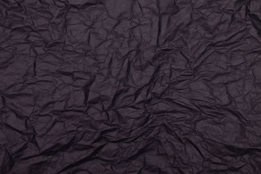 High-quality image of a crinkled black paper surface, ideal for backgrounds and design projects.