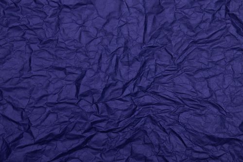 Free Detailed texture of dark blue wrinkled paper, ideal for backgrounds and design projects. Stock Photo