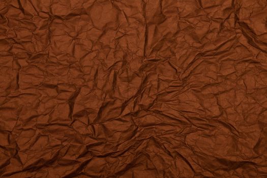 A rich brown textured paper with a crumpled surface, ideal for backgrounds.