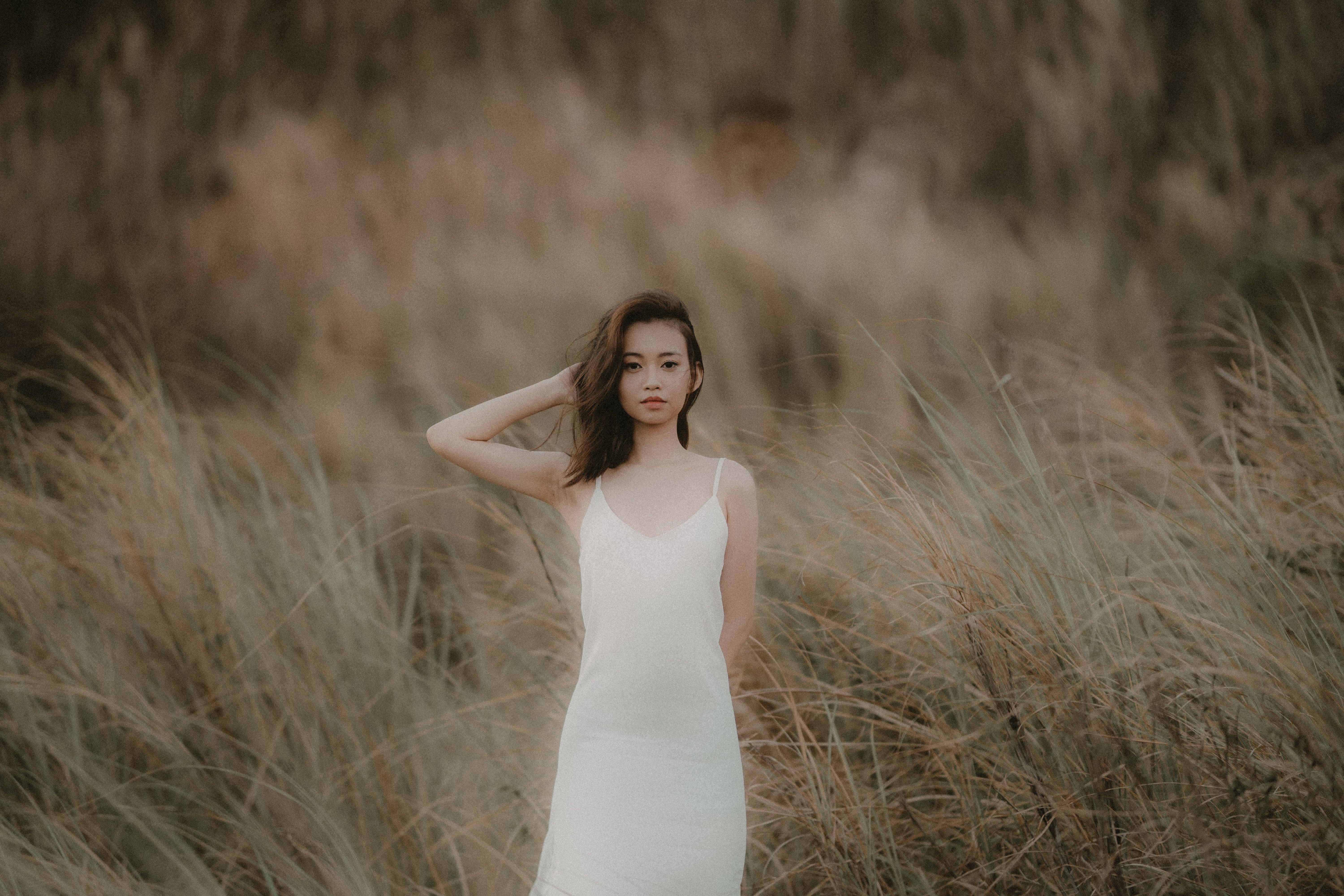 Woman in White Dress Standing in Grass Field · Free Stock Photo