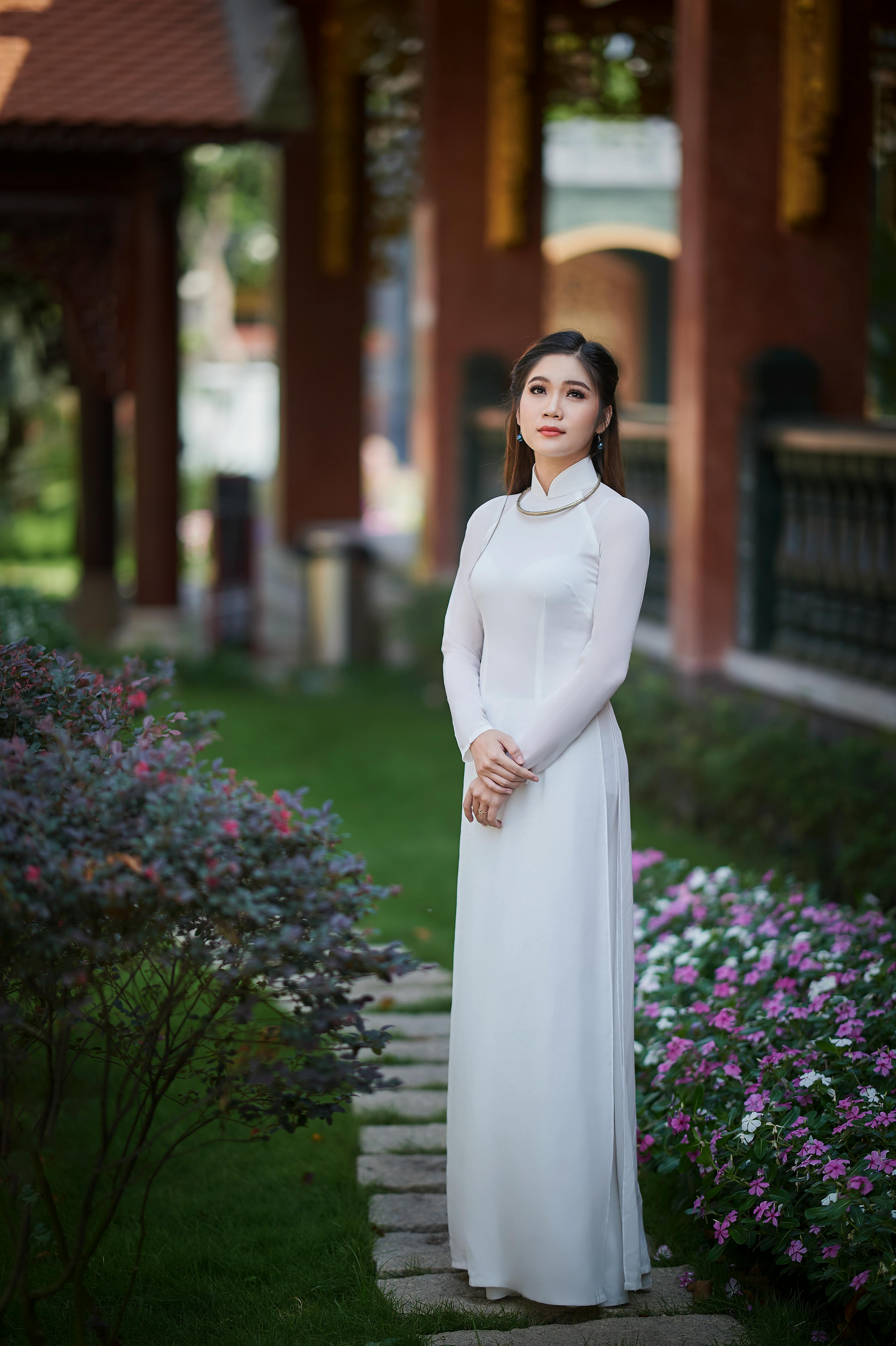 a woman in white long sleeve dress