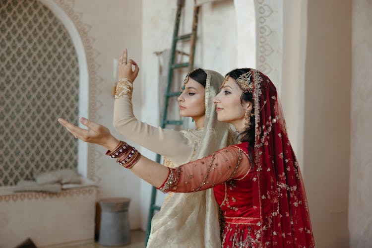 Woman In Red And Gold Sari Dress