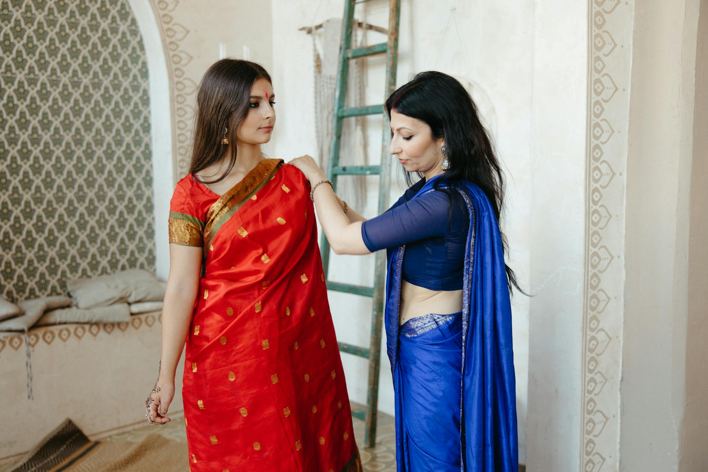Indian Lady Photo by  Anastasia  Shuraeva from Pexels: https://www.pexels.com/photo/women-putting-on-a-red-shawl-8750027/