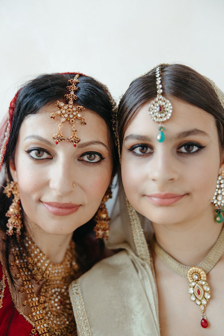 Mother And Daughter Posing Together