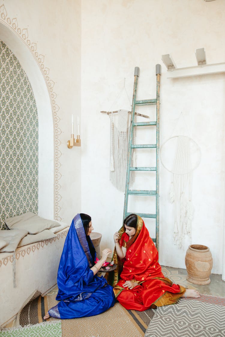 Mother Sitting Beside Her Daughter