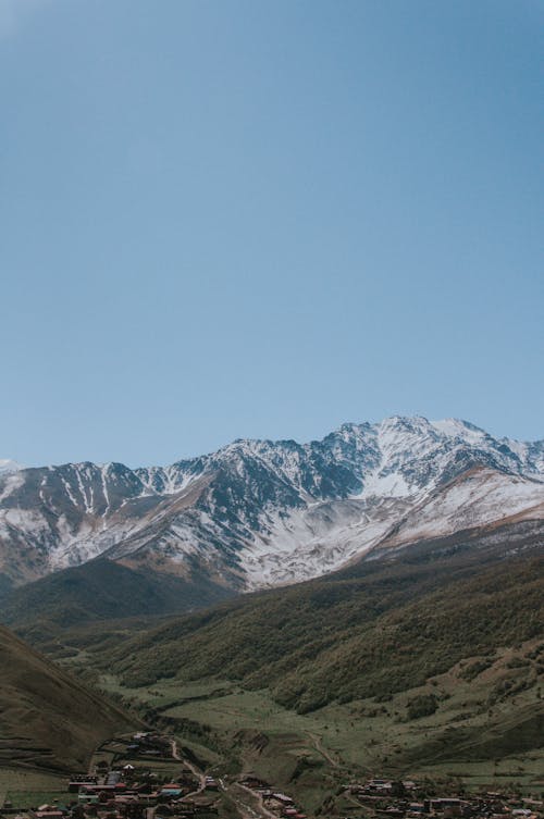 Snow Covered Mountain Under the Blue Sky