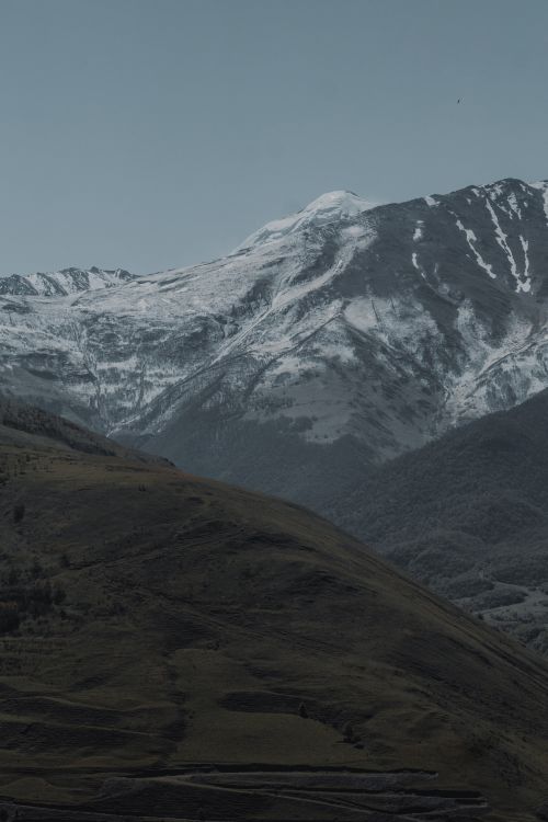 Free Scenic view of snow-covered mountains in North Ossetia, Russia, showcasing natural beauty. Stock Photo