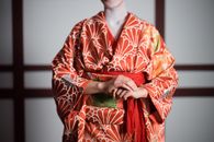 Hands Crossed Woman in Red Floral Kimono
