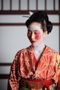 Geisha in Red and White Floral Kimono