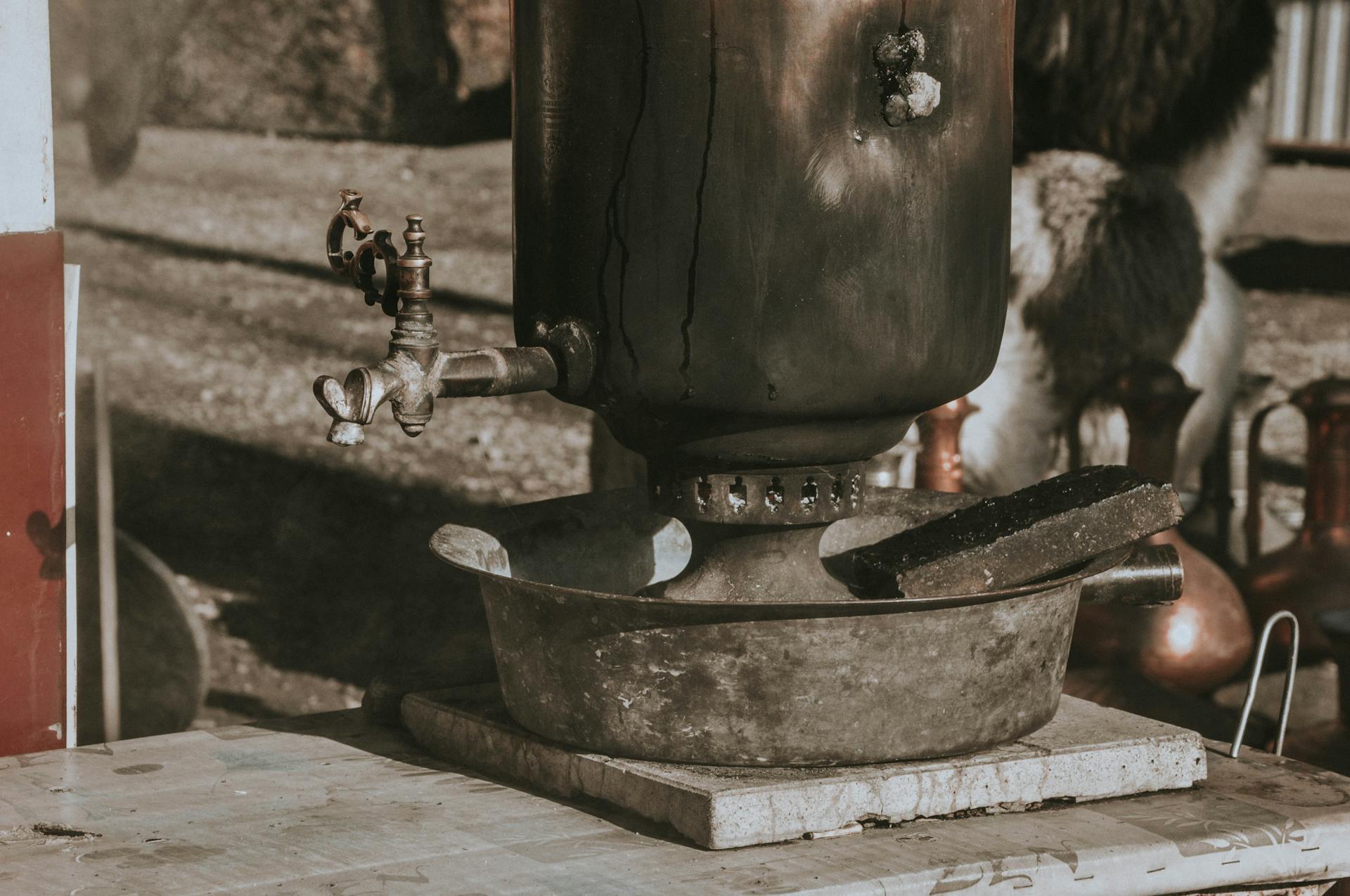 Close-up of an old-fashioned metal boiler outdoors in Adygea, Russia showcasing vintage charm.