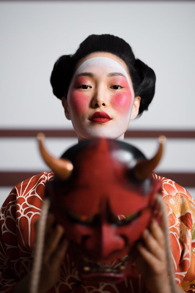 A Woman Holding A Hannya 