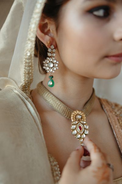 Woman wearing luxury necklace and earrings