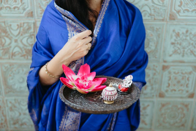 Woman With Lotus Flower Decoration On Tray