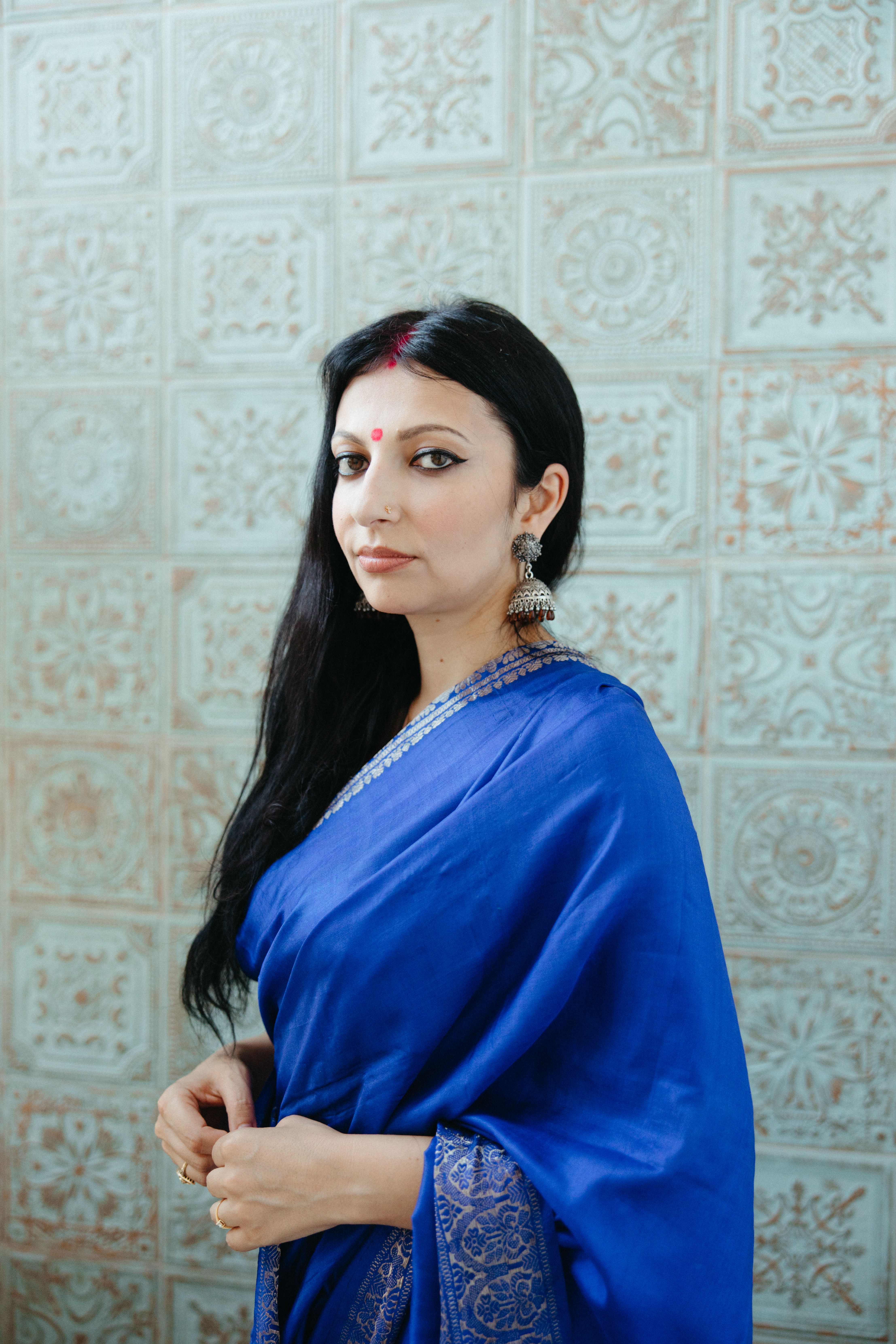 Woman Wearing Blue Sari Posing on a Footbridge in Wind · Free Stock Photo