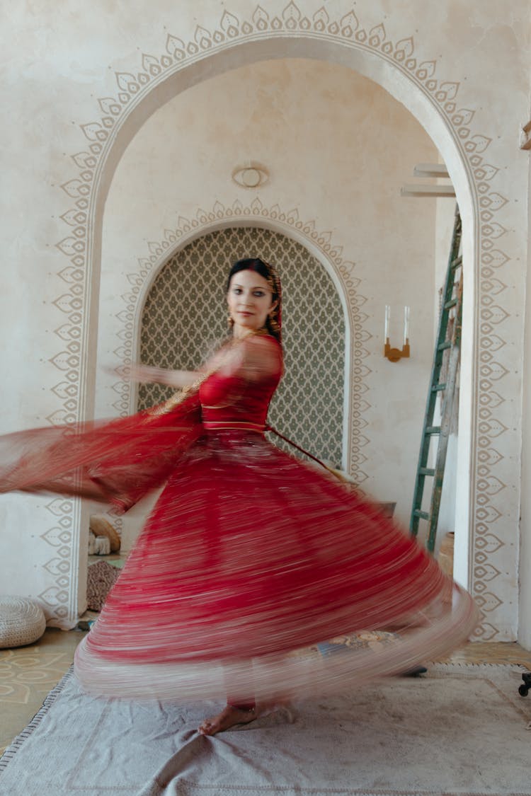 A Woman In A Red Dress Spinning