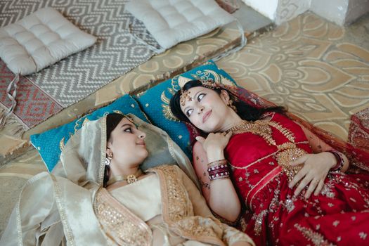 2 Women Lying on Bed