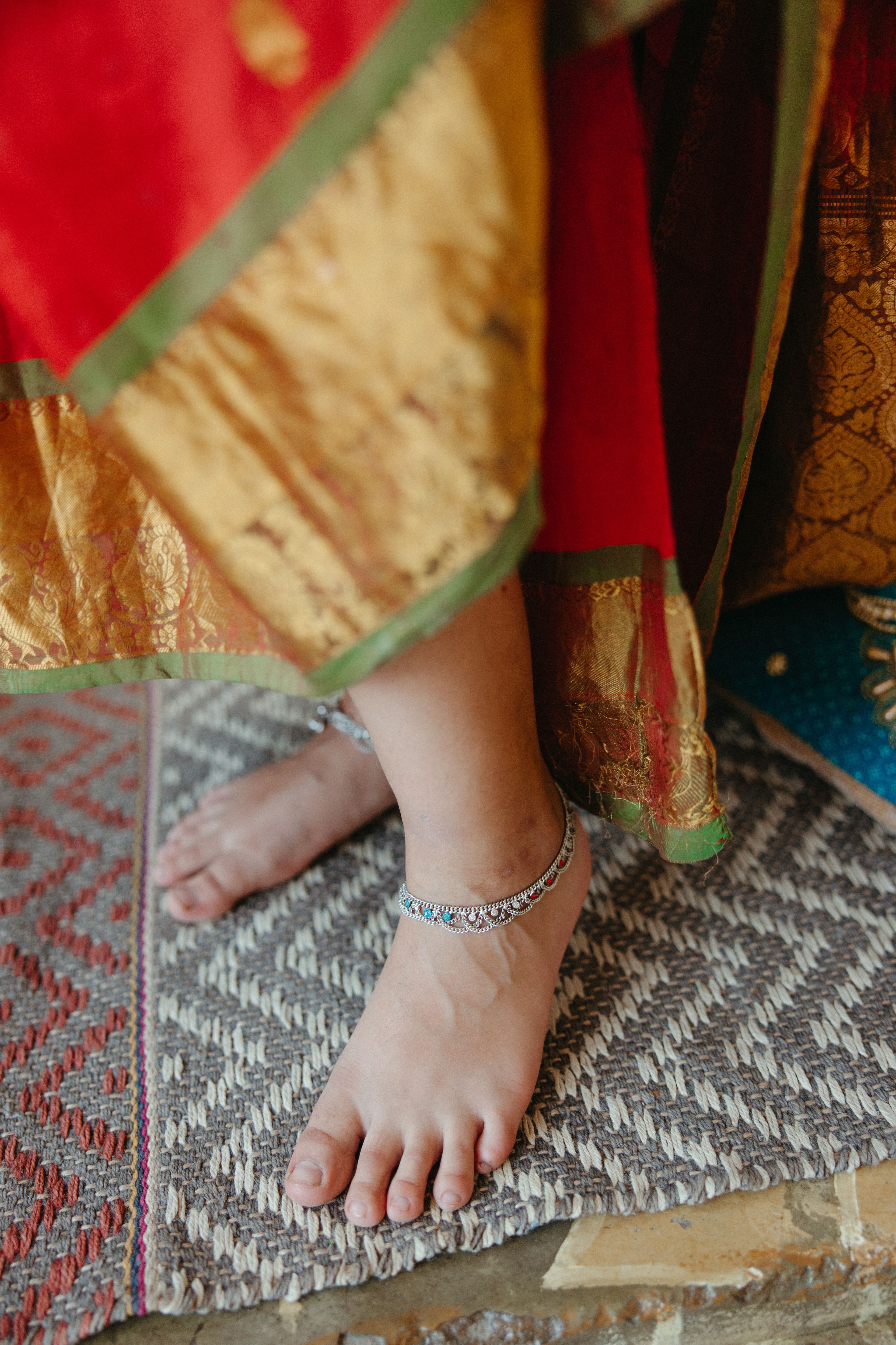 Silver anklet worn with a saree, styled for contemporary Indian wear