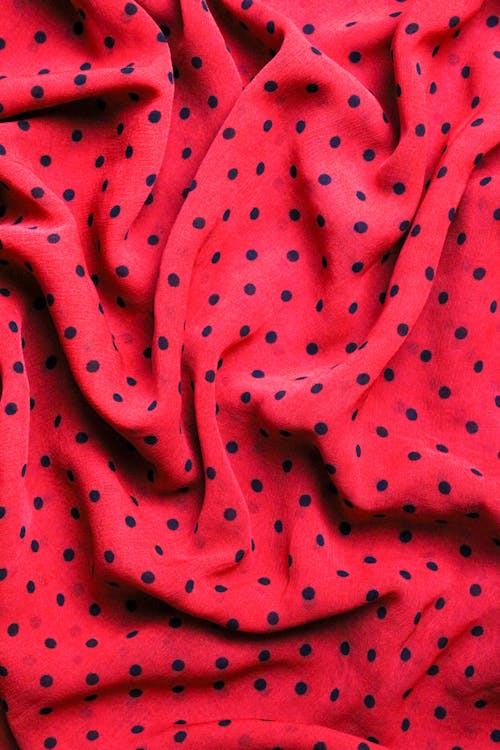 Red and Black Polka Dot Textile