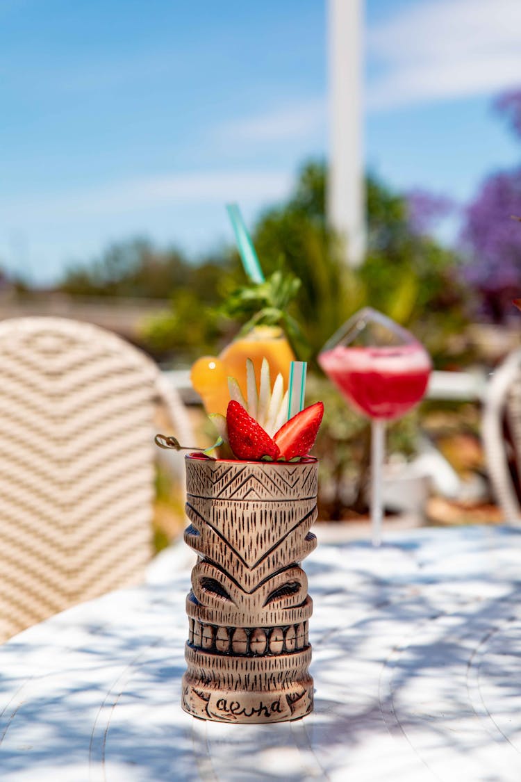 Cocktail On Tiki Mug With Sliced Strawberry