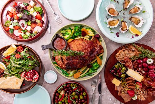 Free Top view of a gourmet feast featuring various dishes, salads, and seafood for an elegant dining experience. Stock Photo