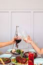 People Holding Clear Wine Glasses With Red and White Wine