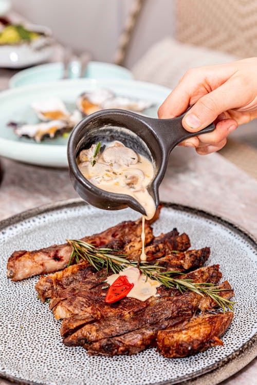 Pouring Mushroom Gravy on Ribs