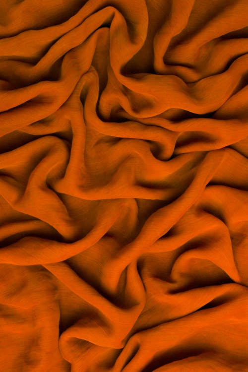 Free Close-up Photo of a Crumpled Orange Fabric  Stock Photo