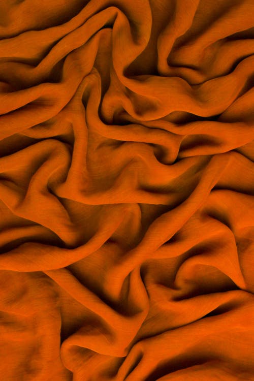 Close-up Photo of a Crumpled Orange Fabric 