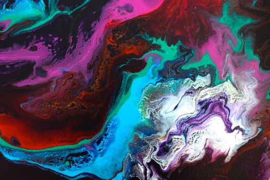 Dynamic abstract painting with vibrant acrylic colors creating fluid swirls and textures.